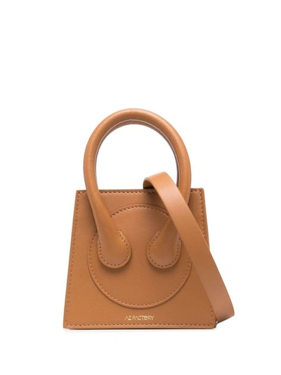 Shop Az Factory By Ester Manas Az Factory X Ester Manas Leather Mini Crossbody Bag In Brown