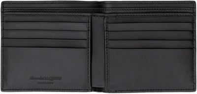 Shop Alexander Mcqueen Leather Flap-over Wallet In Black