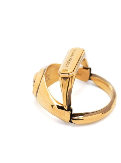 Shop Alexander Mcqueen Gold-colored Double Ring With Skull Detail And Embossed Logo Lettering In Brass Woman In Metallic
