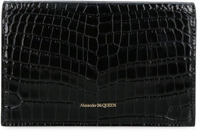 Shop Alexander Mcqueen Skull Croco-print Leather Clutch In Black
