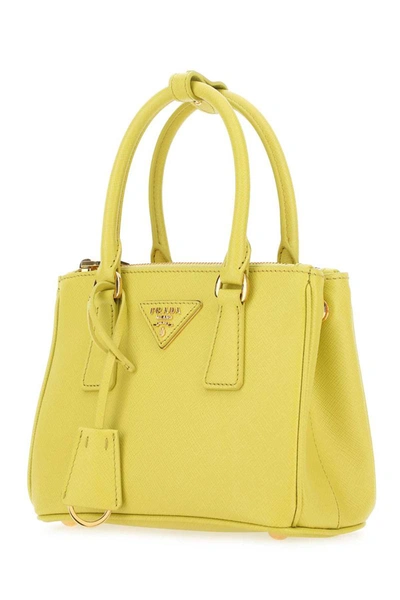 Cargo handbag Prada Yellow in Synthetic - 31996885