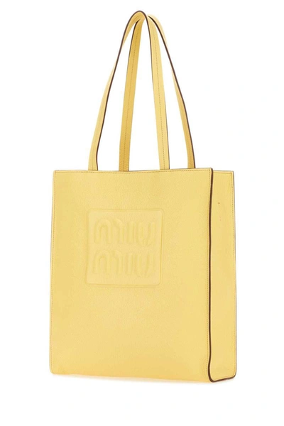Shop Miu Miu Handbags. In Yellow