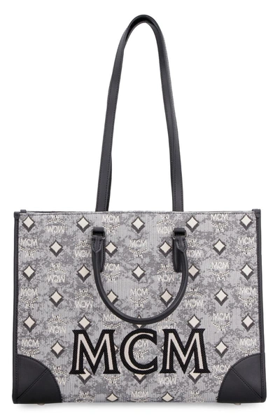 Shop Mcm All Over Logo Canvas Tote In Grey