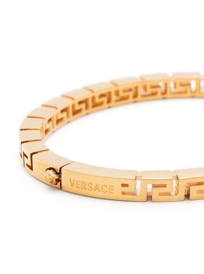 Shop Versace Greca-chain Bracelet In Gold-tone Brass Man In Metallic
