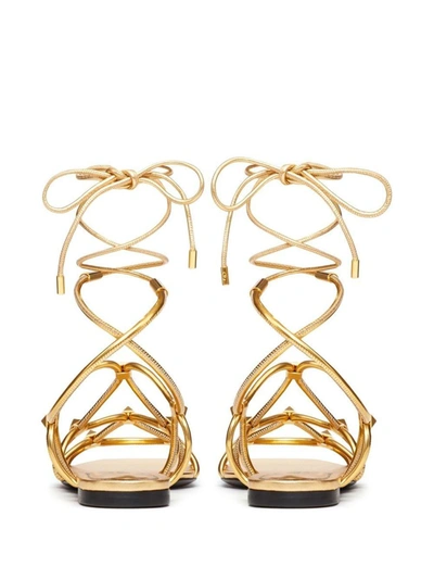 Shop Valentino Garavani Rockstud Net Flat Sandals In Golden