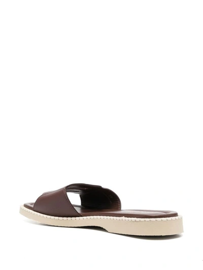 Shop Hogan Flat Shoes In <p>h638 Flat Leather Sandals From  Featuring Chocolate Brown, Calf Leather, Debossed Logo To Th
