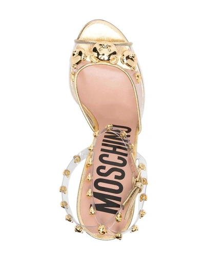 Shop Moschino Sandals In Golden