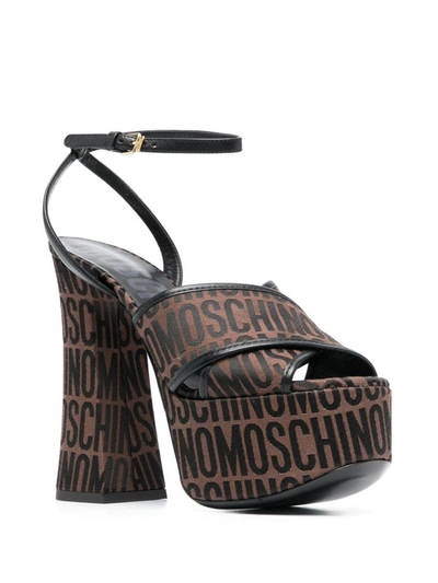 Shop Moschino Sandals In Brown
