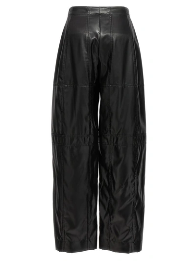 Shop Jil Sander Coated Pants In Black