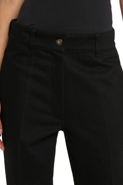 Shop Patou High-rise Flared Jeans In Black