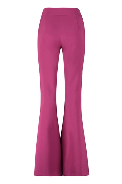 Shop Moschino Flared Crêpe Trousers In Purple