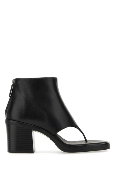 Miu Miu Leather Thong Ankle Boots In Black