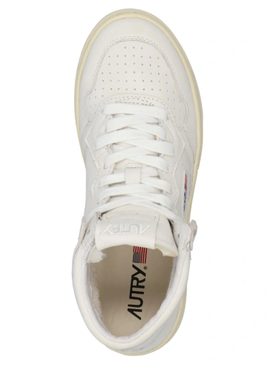 Shop Autry ' 01 Mid' Sneakers In White