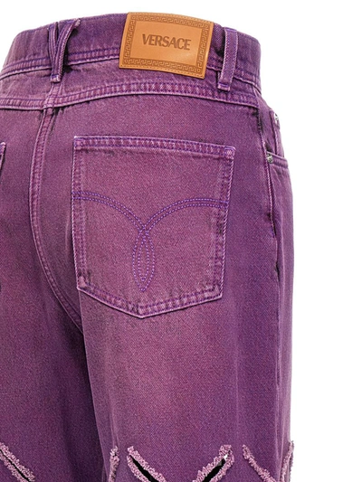 Shop Versace 'medusa' Jeans In Purple