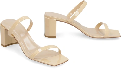 Shop By Far Tanya Kraft Patent Leather Mules In Beige