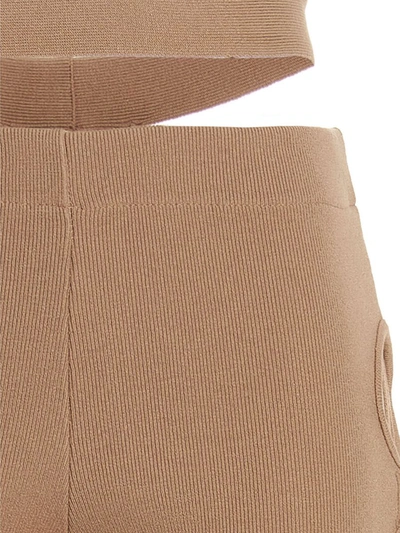 Andreädamo Flared Trousers With Cut-out And Ribbed Texture In Beige