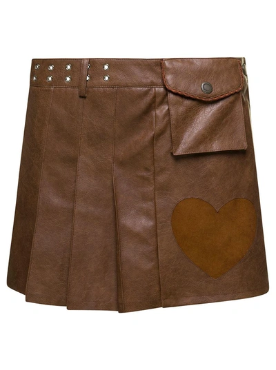 Shop Andersson Bell 'arina' Brown Pleated Mini Skirt With Heart And Patch Pocket Detail In Faux Leather Woman