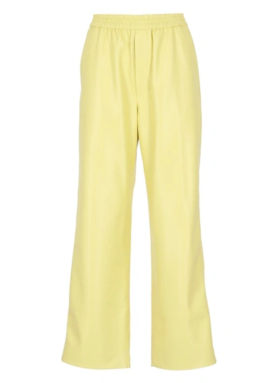 Shop Nanushka Trousers Yellow