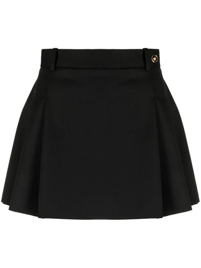 Shop Versace Low-rise Pleated Mini Skirt In Black