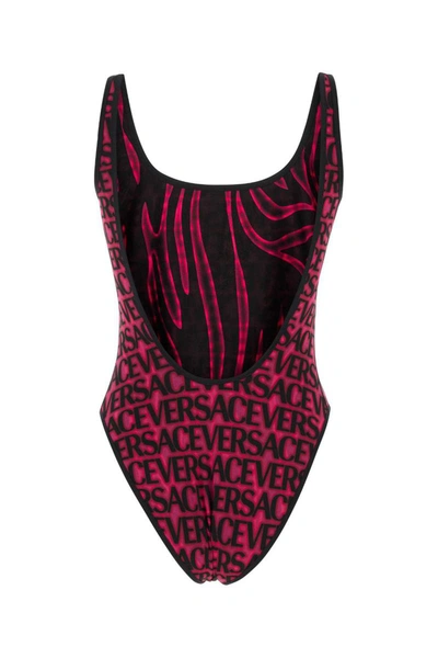 Shop Versace Swimsuits In Blacktropicalpink