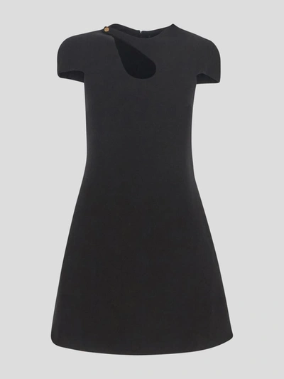 Shop Versace Wool Cut-out Dress In <p> Black Wool Cut-out Dress With Short Sleeves And Medusa Button