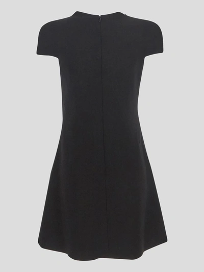 Shop Versace Wool Cut-out Dress In <p> Black Wool Cut-out Dress With Short Sleeves And Medusa Button