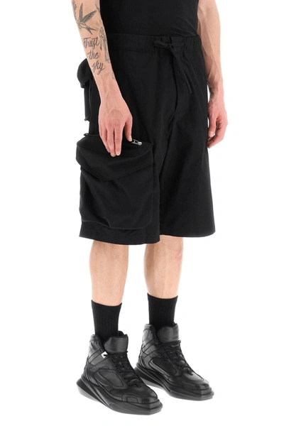 Shop Oamc Oversized Shorts With Maxi Pockets In Black