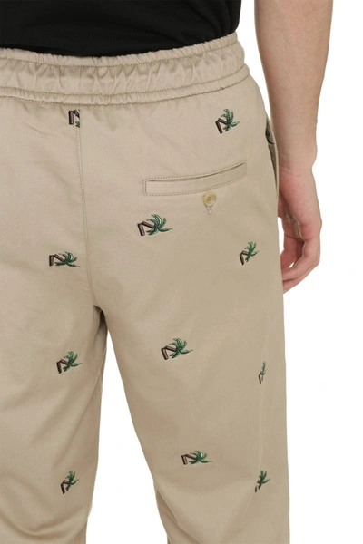 Shop Palm Angels Embroidered Cotton Trousers In Beige