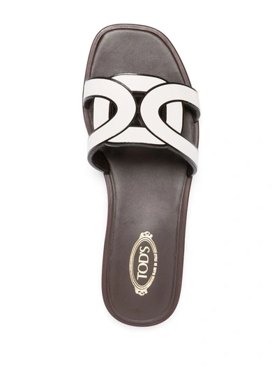 Shop Tod's Leather Flat Sandals In White
