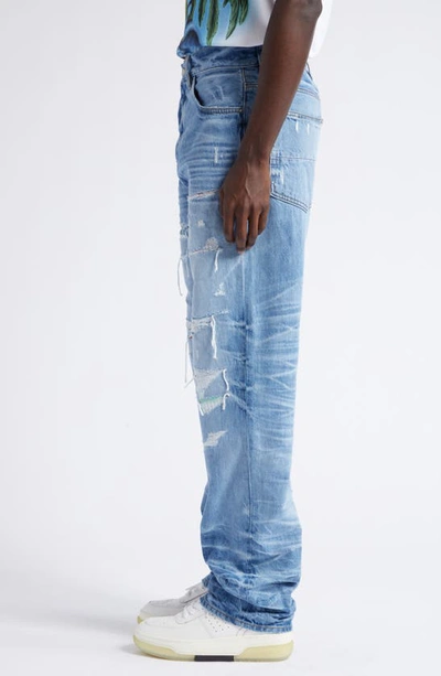 Shop Amiri Aloha Print Patch Ripped Straight Leg Jeans In Faded Indigo