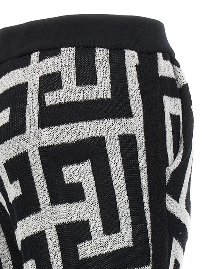 Shop Balmain Logo Pattern Pants In White/black