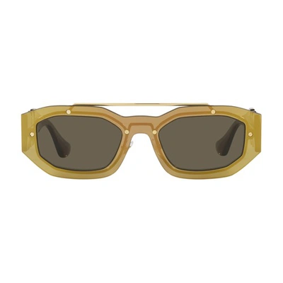 Shop Versace Biggie Irregular Sunglasses In Transparent_brown_mirror_gold_brun