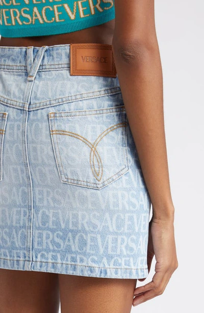 Shop Versace Logo Print Denim Miniskirt In 1d190 Light Blue
