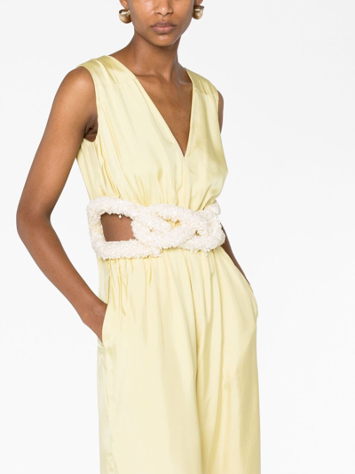 Shop Jil Sander Cut-out Belted Satin Jumpsuit In Yellow