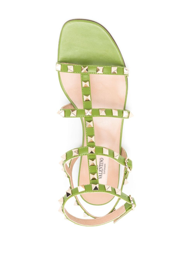 Shop Valentino Rockstud-embellished Flat Sandals In Grün