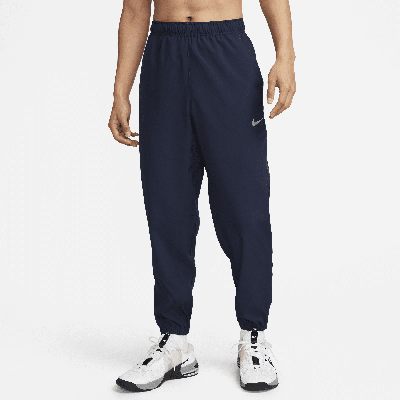 Shop Nike Men's Form Dri-fit Tapered Versatile Pants In Blue