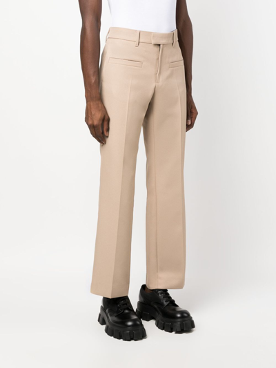 Courrèges Pressed-crease Cropped Trousers In Neutrals