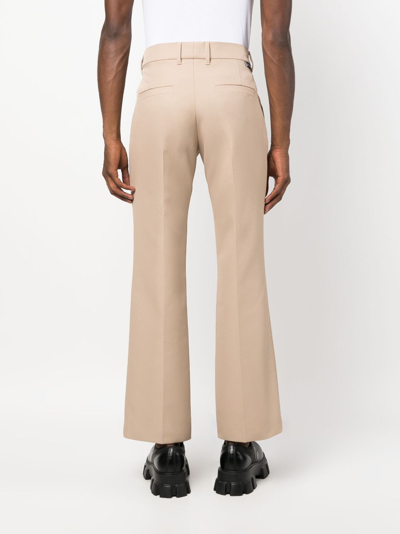 Courrèges Pressed-crease Cropped Trousers In Neutrals