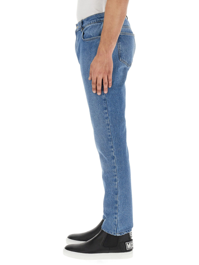 Shop Moschino Teddy Patch Jeans In Blu