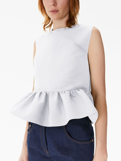 Shop Nina Ricci Bow-detail Peplum Sleeveless Cotton Top In White