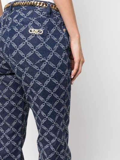 Shop Michael Michael Kors Monogram-pattern Flared Jeans In Blue