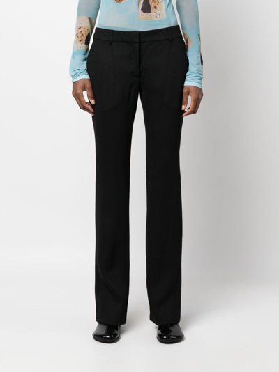 Acne Studios Low-waisted Flared Trousers In Schwarz