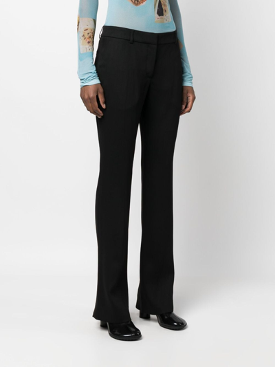 Acne Studios Low-waisted Flared Trousers In Schwarz