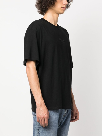 Shop Sandro Debossed-logo Cotton T-shirt In Black