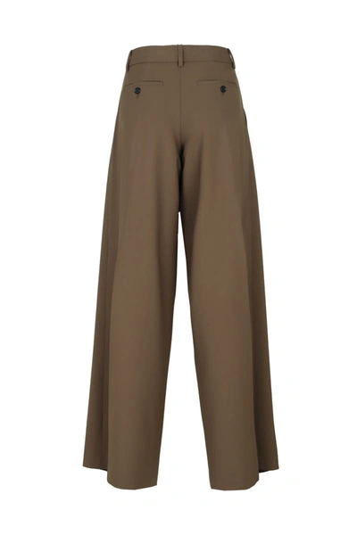 Shop Theory Trousers With Pleats In Brown