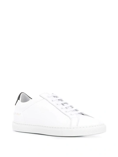 Shop Common Projects Trainers In White Black