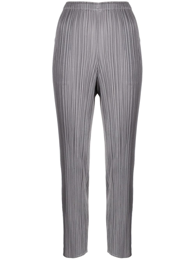 Shop Issey Miyake Slim-cut Micro-pleated Trousers In Grey