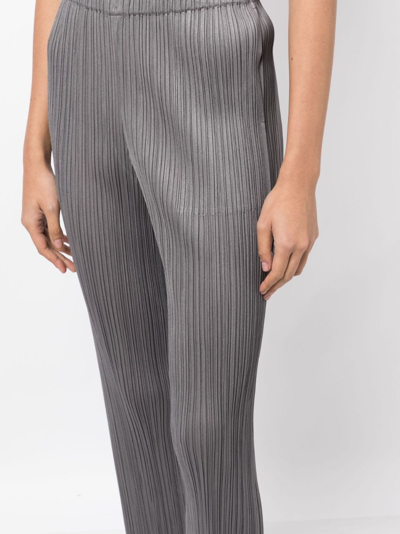 Shop Issey Miyake Slim-cut Micro-pleated Trousers In Grey
