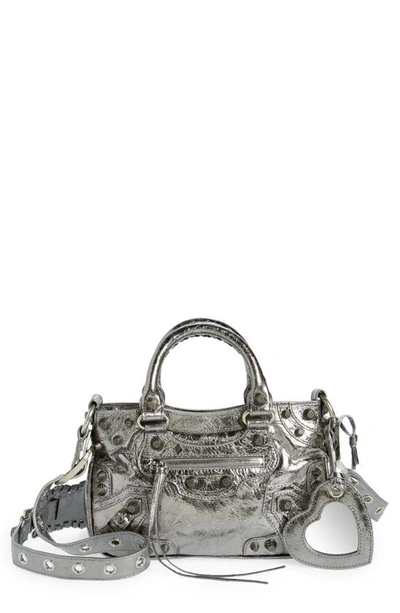 Shop Balenciaga Small Cagole Metallic Leather Top Handle Bag In Silver