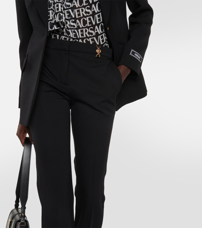 Versace Black Flared Tailored Low Waisted Pants In Stretch Wool Woman In Black